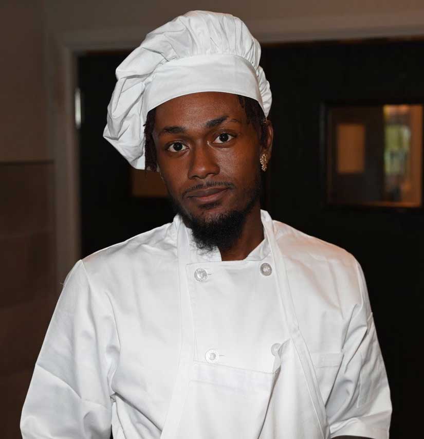 Chef Dee in white coat and hat